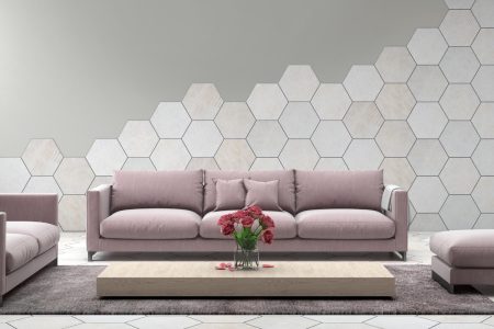 Grape Mist colored couch against gray wall with white hexagonal tiles